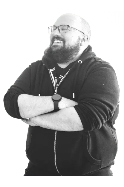 Tech expert smiling at the team